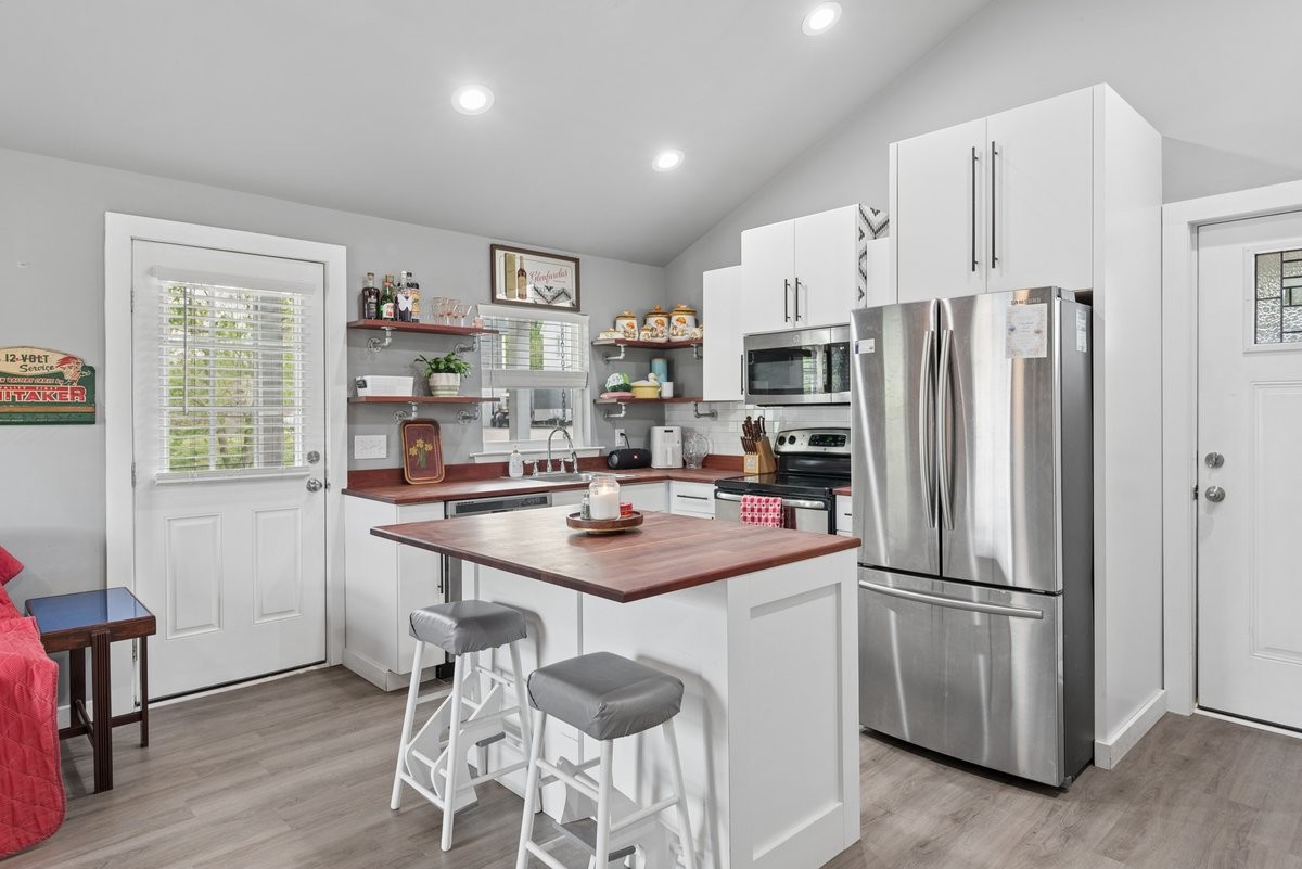 150 Crawford Hill Road Goodlettsville, TN 37072 - Photo 20 of 30 a kitchen with stainless steel appliances a refrigerator and a stove top oven