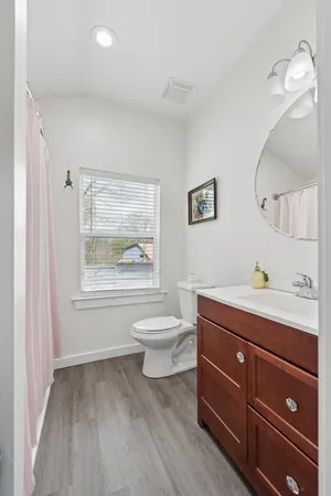 a bedroom with a bed and a table in it