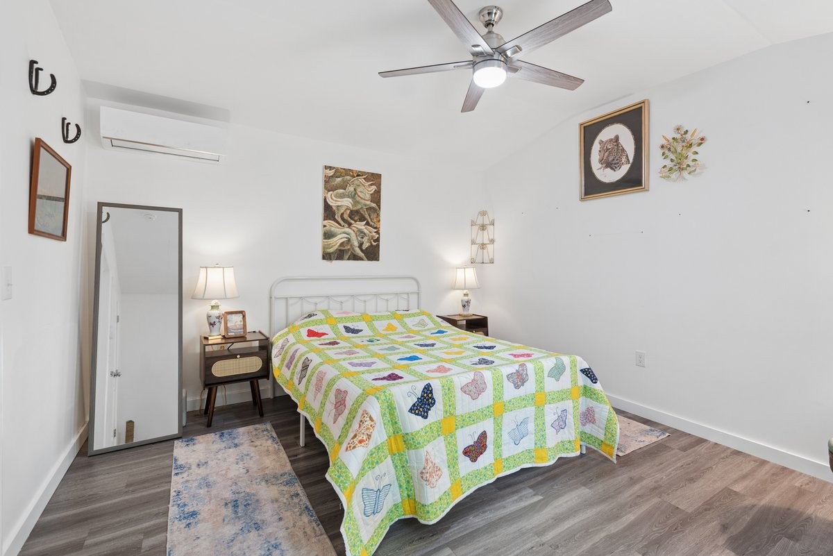 150 Crawford Hill Road Goodlettsville, TN 37072 - Photo 27 of 30 a bedroom with a bed and a chandelier