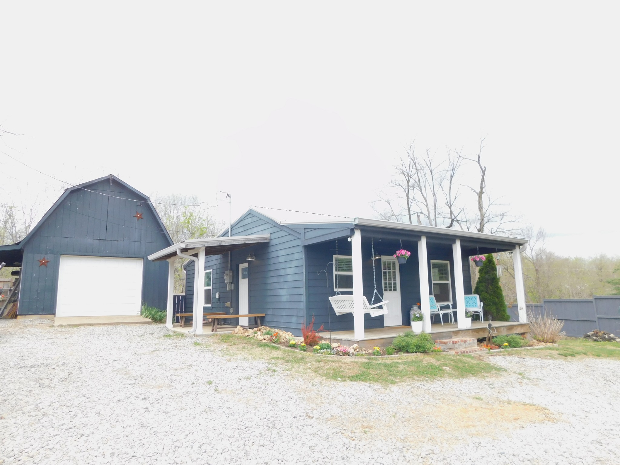 150 Crawford Hill Road Goodlettsville, TN 37072 - Photo 5 of 30 a front view of a house with a garden and yard