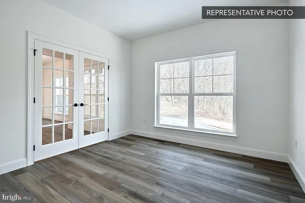 a view of entryway dining room and hall with wooden floor