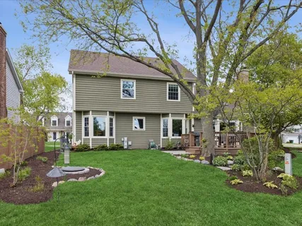 a view of a house with a yard porch and sitting area