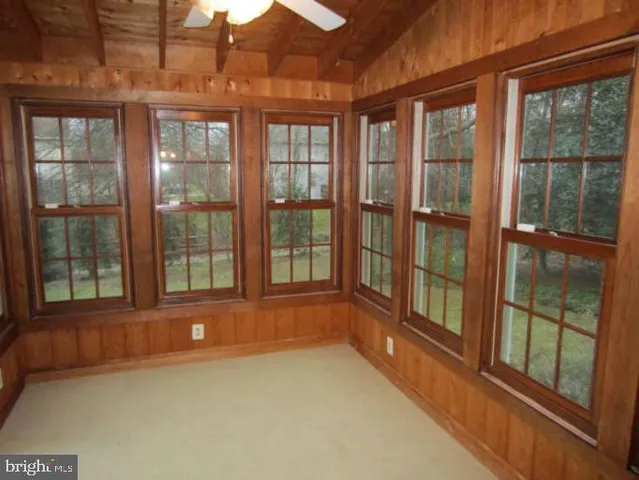 a view of an empty room with a large window