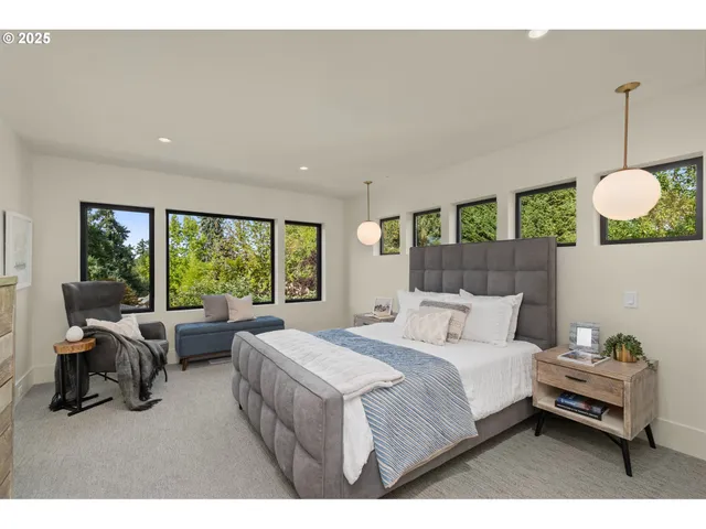 a bedroom with a bed window and couch