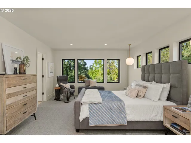 a bedroom with a bed and glass window