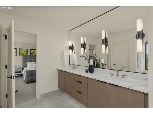 a bathroom with a double vanity sink and a mirror