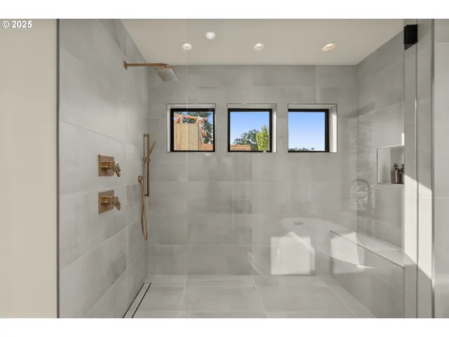 a bathroom with a glass door shower