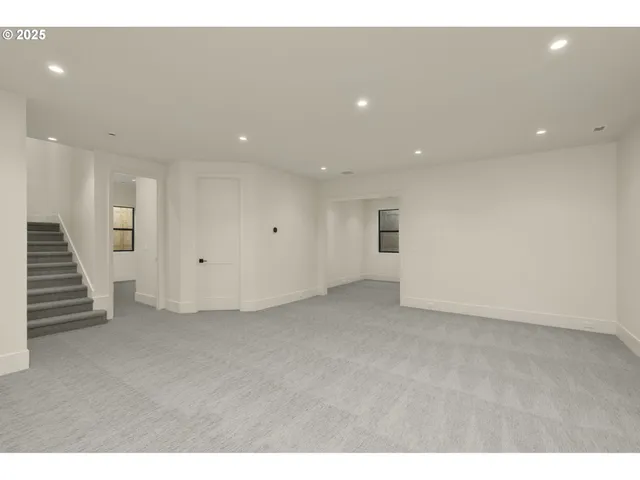 a view of an empty room with stairs