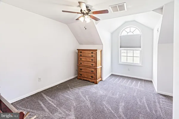 a living room with a sink and furniture