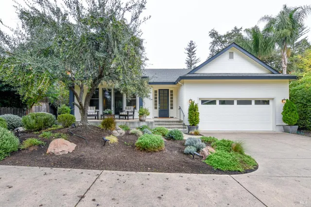 a front view of a house with garden