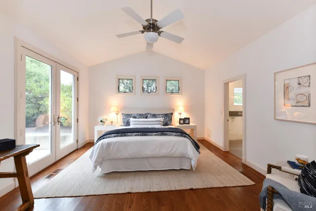 a bedroom with a bed and a table in it