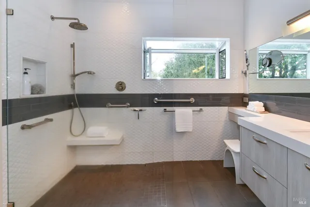 a bathroom with a sink a toilet and mirror