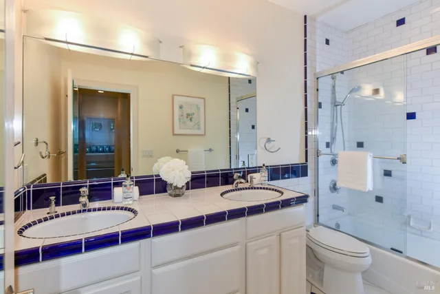a bathroom with a double vanity sink double mirror