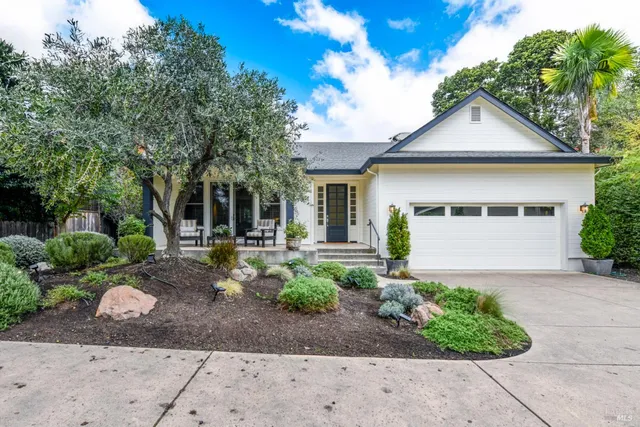 a front view of a house with garden