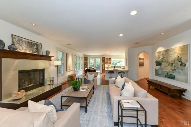 a living room with fireplace furniture and a flat screen tv