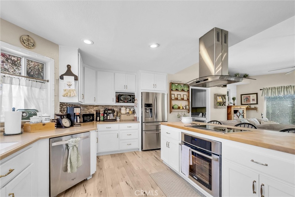 2006 Peyton Road La Verne, CA 91750 - Photo 11 of 17 a kitchen with stainless steel appliances a sink stove and cabinets