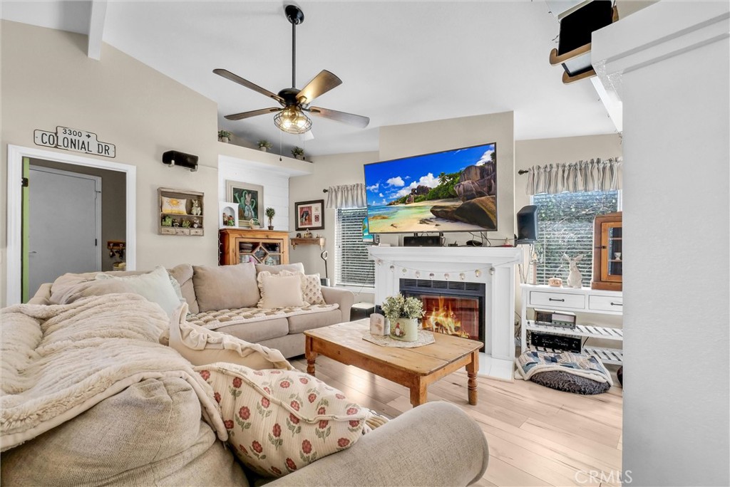 2006 Peyton Road La Verne, CA 91750 - Photo 8 of 17 a living room with furniture a fireplace and a flat screen tv