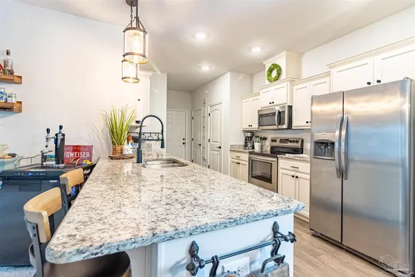 a kitchen with a stove and a table