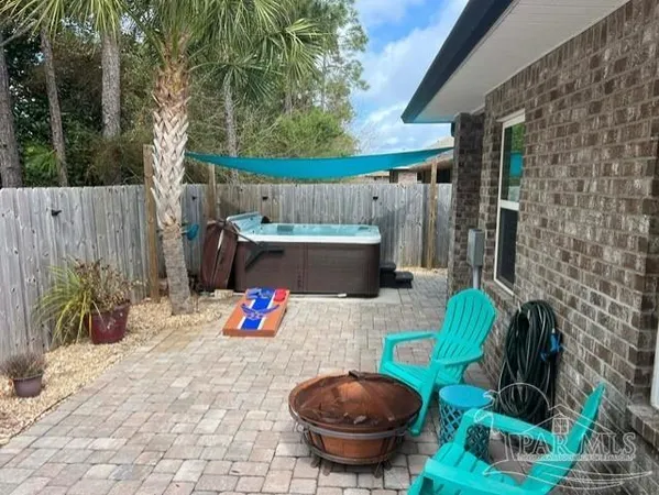 a view of an house with backyard porch and furniture