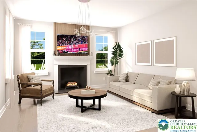 a living room with furniture a rug and a fireplace