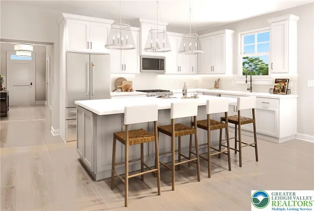 a dining hall with stainless steel appliances kitchen island granite countertop a dining table and chairs