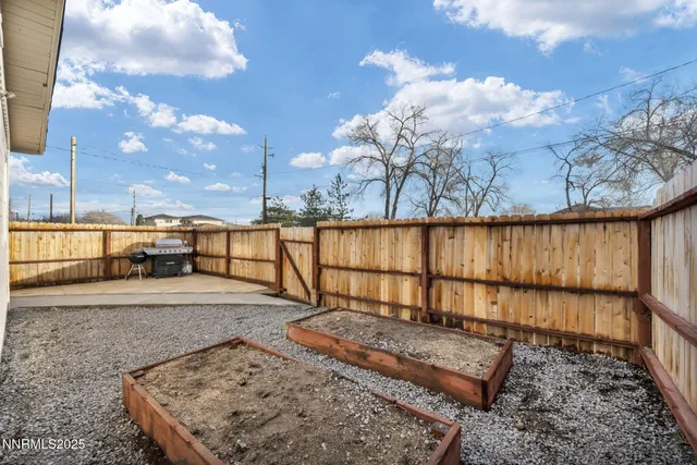 a view of a backyard with sitting area