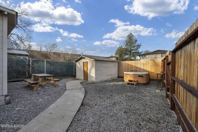 a view of a garage with a tree