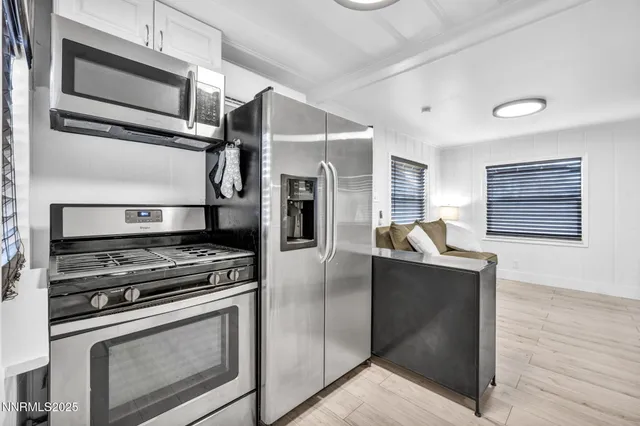 a kitchen with a sink and refrigerator