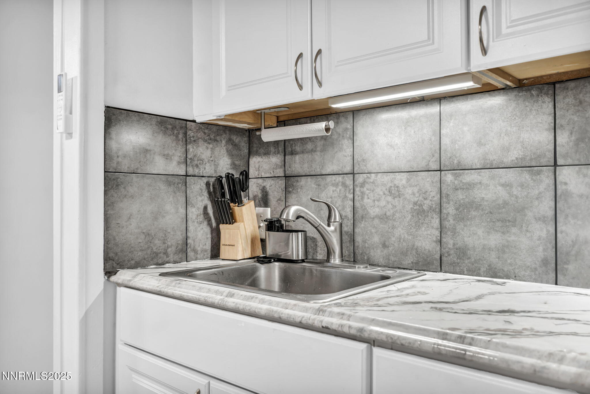 459 Field Street Sparks, NV 89431 - Photo 23 of 30 a kitchen with a sink a refrigerator and cabinets