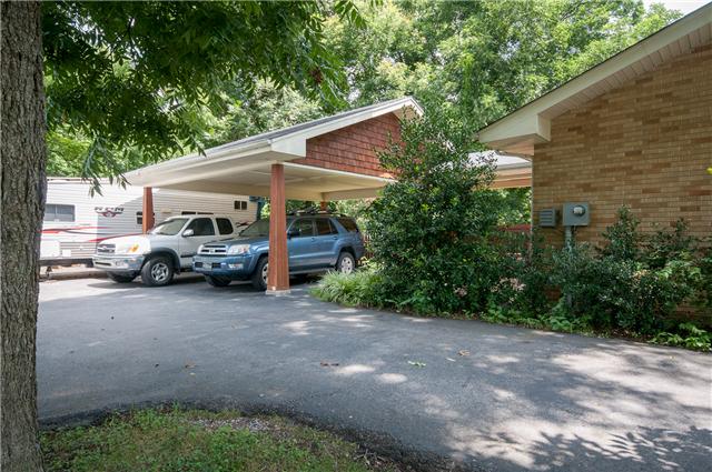 350 Stable Road Franklin, TN 37069 - Photo 17 of 18 Complimenting Carport matches the craftsman detail throughout the home. It features a covered roof to the back door.