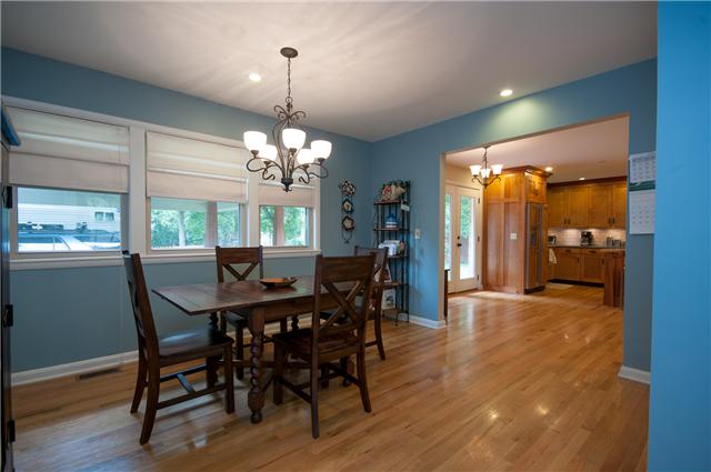 350 Stable Road Franklin, TN 37069 - Photo 8 of 18 Formal "L" shaped Dining Room off Eat In Kitchen area features hardwood floors and looks out to backyard.