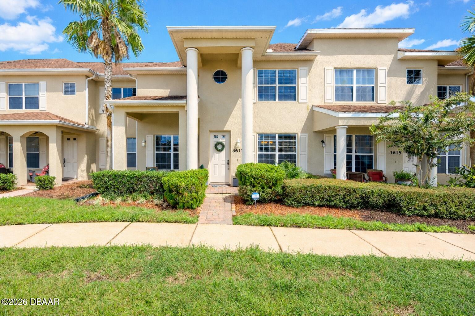 3617 Romea Circle New Smyrna Beach, FL 32168 - Photo 1 of 28 a front view of a house with a yard
