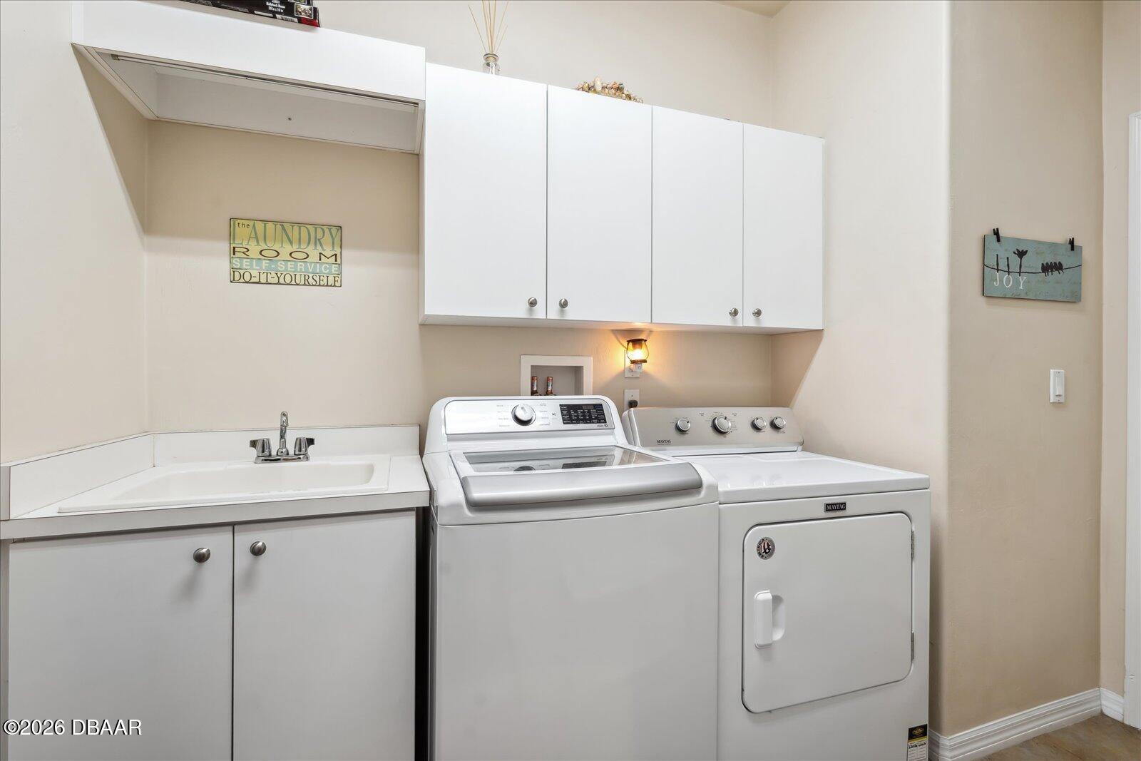 3617 Romea Circle New Smyrna Beach, FL 32168 - Photo 13 of 28 a utility room with dryer and washer