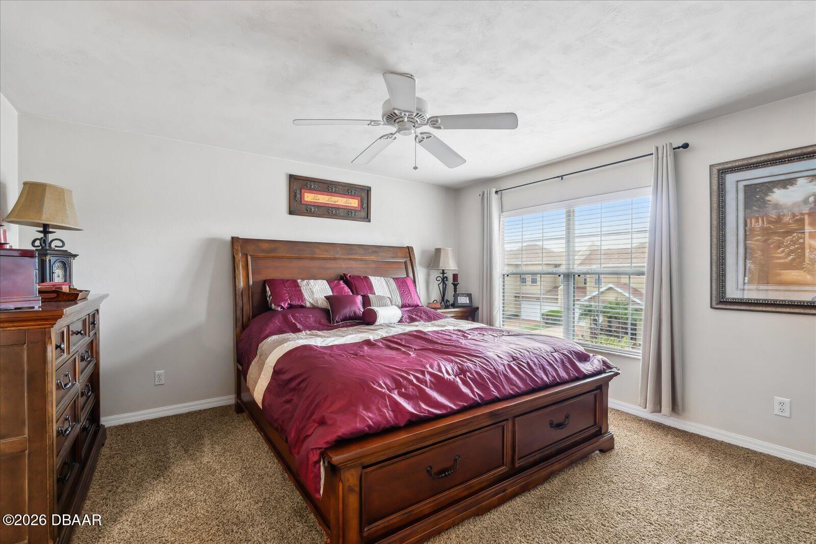 3617 Romea Circle New Smyrna Beach, FL 32168 - Photo 15 of 28 a bed sitting in a bedroom next to a window