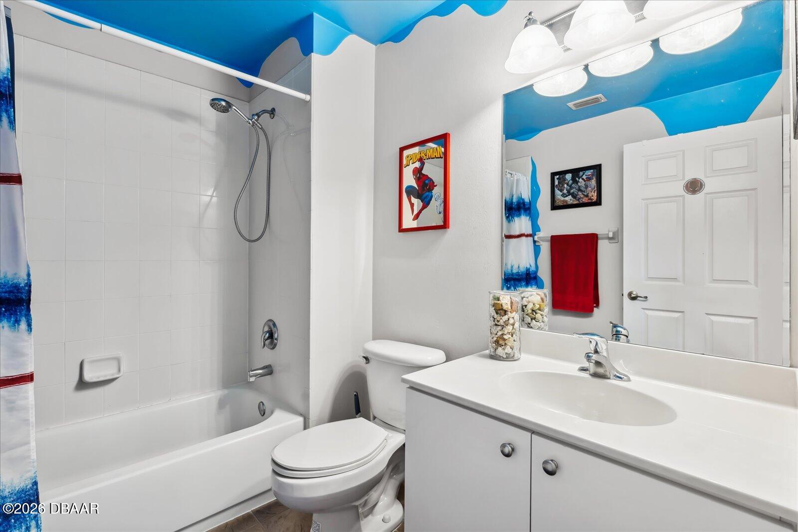 3617 Romea Circle New Smyrna Beach, FL 32168 - Photo 20 of 28 a bathroom with a sink a toilet and a bathtub