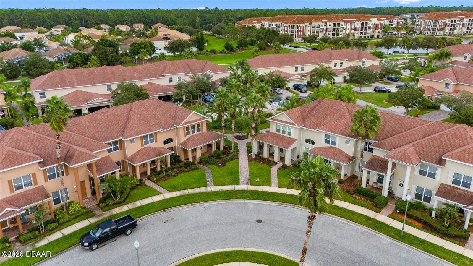 3617 Romea Circle New Smyrna Beach, FL 32168 - Photo 24 of 28 an aerial view of multiple houses with yard
