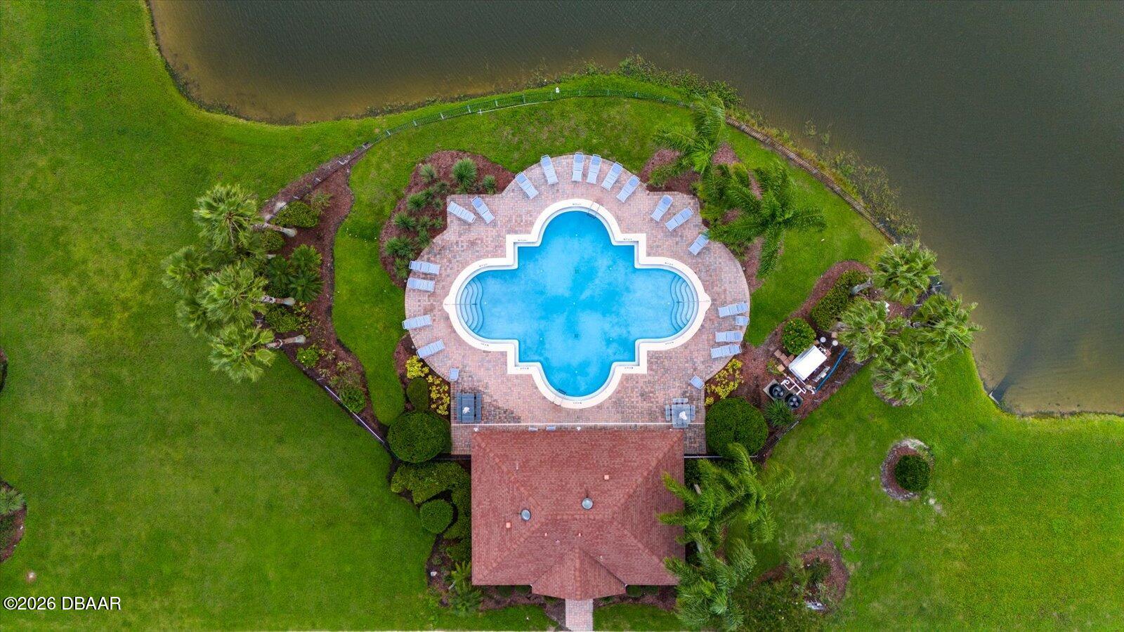3617 Romea Circle New Smyrna Beach, FL 32168 - Photo 28 of 28 an aerial view of a house with a swimming pool and outdoor seating