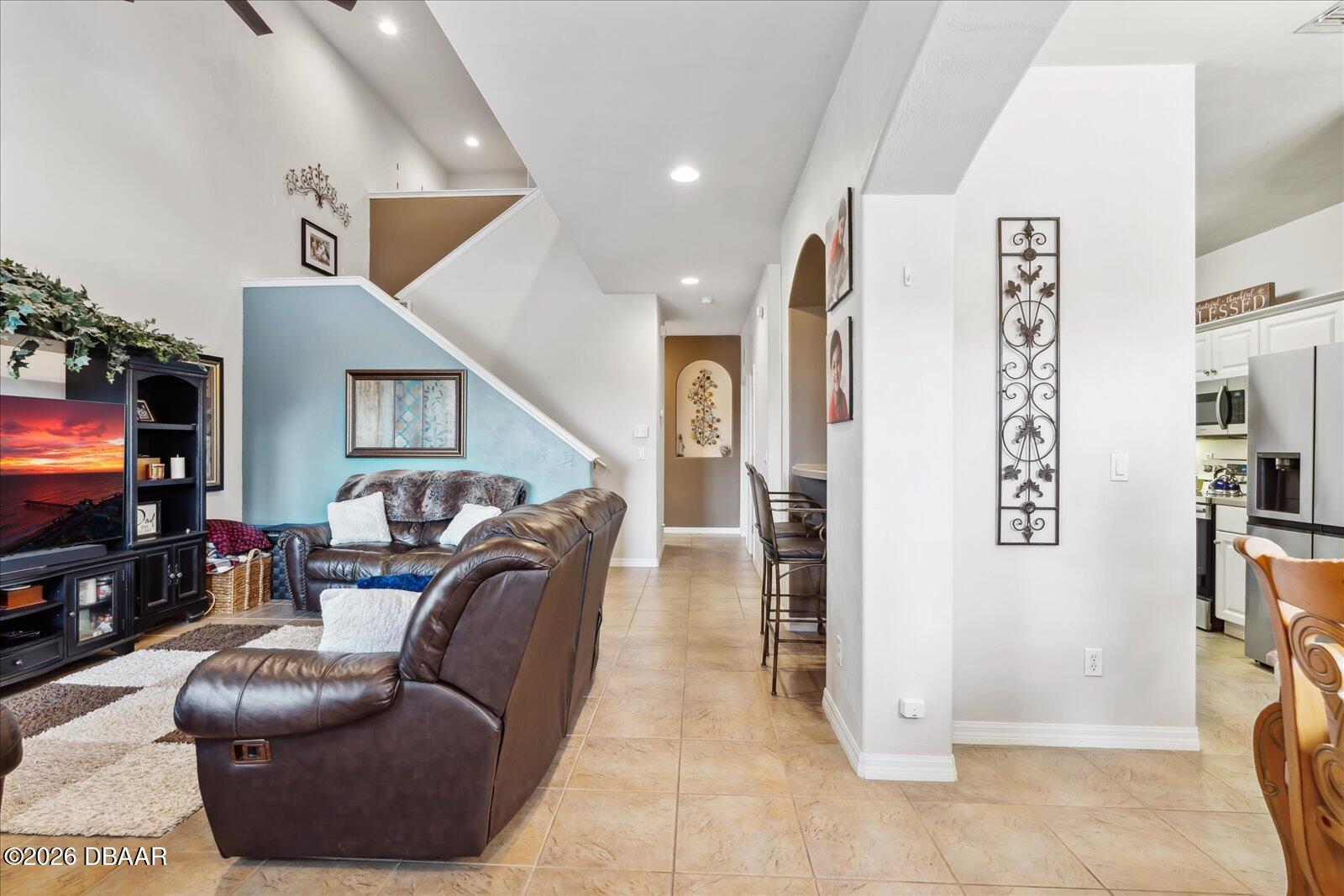 3617 Romea Circle New Smyrna Beach, FL 32168 - Photo 5 of 28 a living room with furniture and a flat screen tv