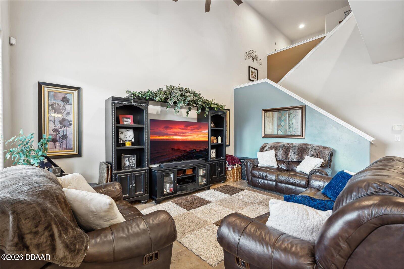 3617 Romea Circle New Smyrna Beach, FL 32168 - Photo 6 of 28 a living room with furniture and a flat screen tv