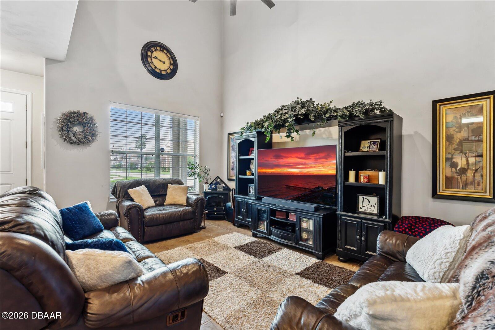 3617 Romea Circle New Smyrna Beach, FL 32168 - Photo 7 of 28 a living room with furniture and a flat screen tv