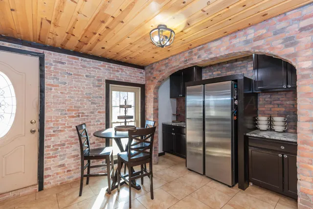a view of a house with wooden fence