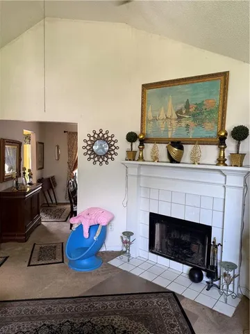 a living room with blue lights furniture and a floor to ceiling window