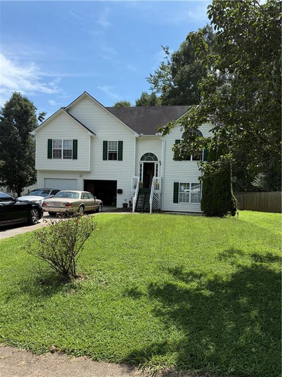 3903 Doe Run Drive Powder Springs, GA 30127 - Photo 2 of 60 a house view with a garden space