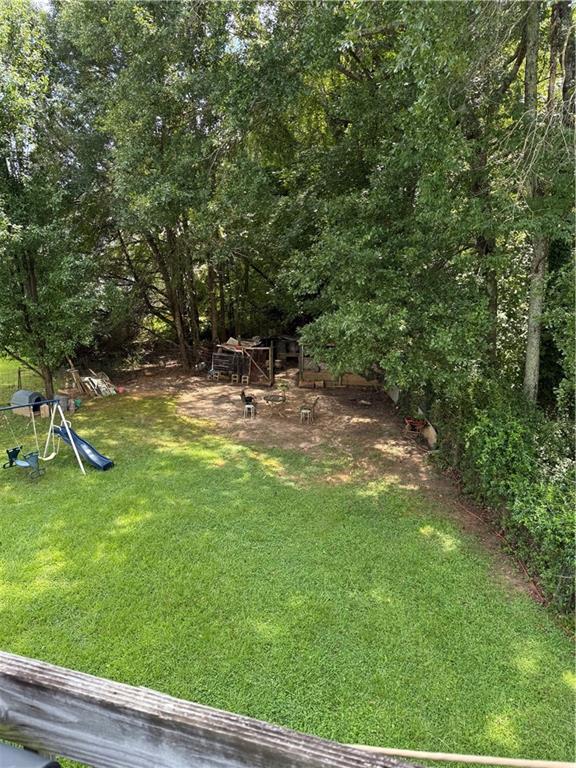3903 Doe Run Drive Powder Springs, GA 30127 - Photo 22 of 60 a view of swimming pool with a yard