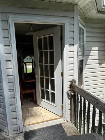 a bedroom with a bed and a small bathroom