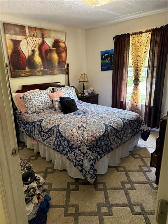 3903 Doe Run Drive Powder Springs, GA 30127 - Photo 25 of 60 a bedroom with a bed and window