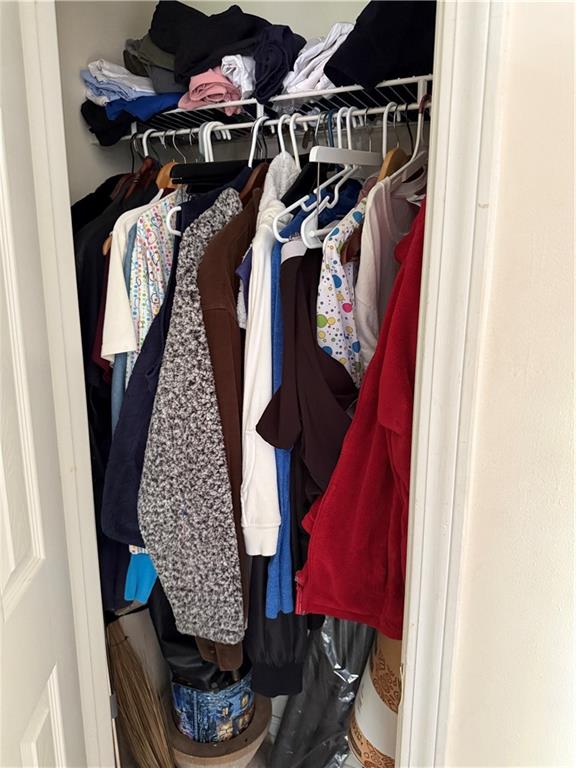 3903 Doe Run Drive Powder Springs, GA 30127 - Photo 27 of 60 a view of walk in closet with clothes and shoes