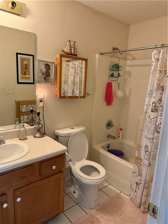 3903 Doe Run Drive Powder Springs, GA 30127 - Photo 31 of 60 a bathroom with a sink toilet and shower