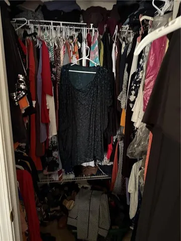 a view of staircase with wooden floor and a potted plant