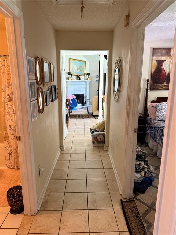 3903 Doe Run Drive Powder Springs, GA 30127 - Photo 41 of 60 a hallway with a dining table and a mirror